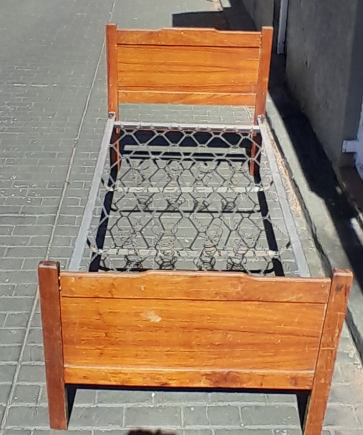 Steel single bed with wooden boards