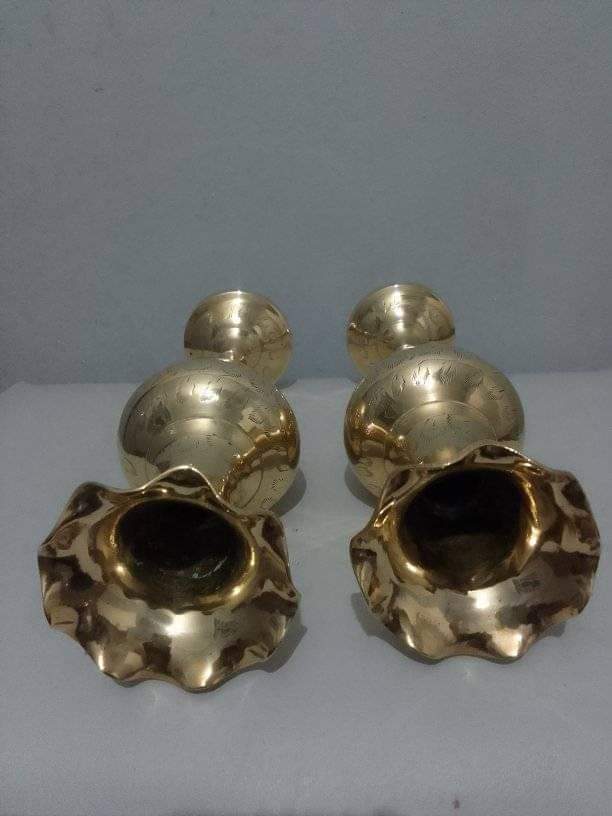 A pair of brass vases