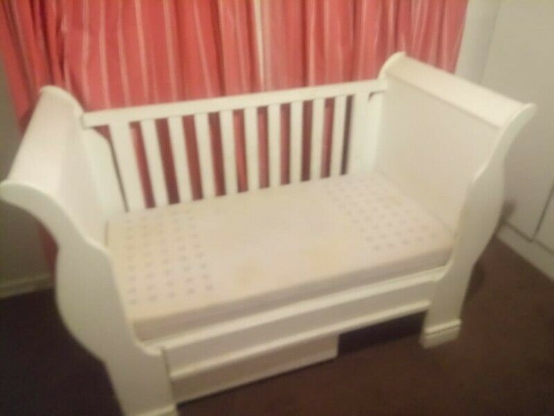 white wooden cot