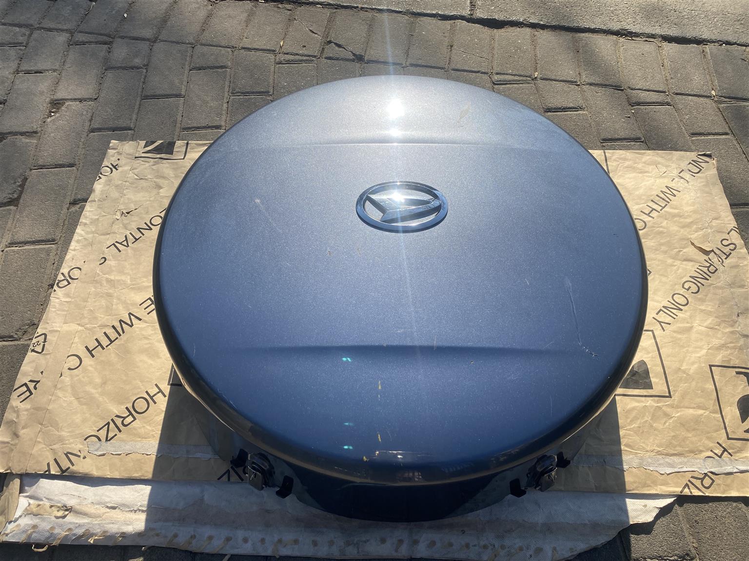 2010 DAIHATSU TERIOS COMPLETE SPARE WHEEL COVER FOR SALE. IN PRISTINE CONDITION