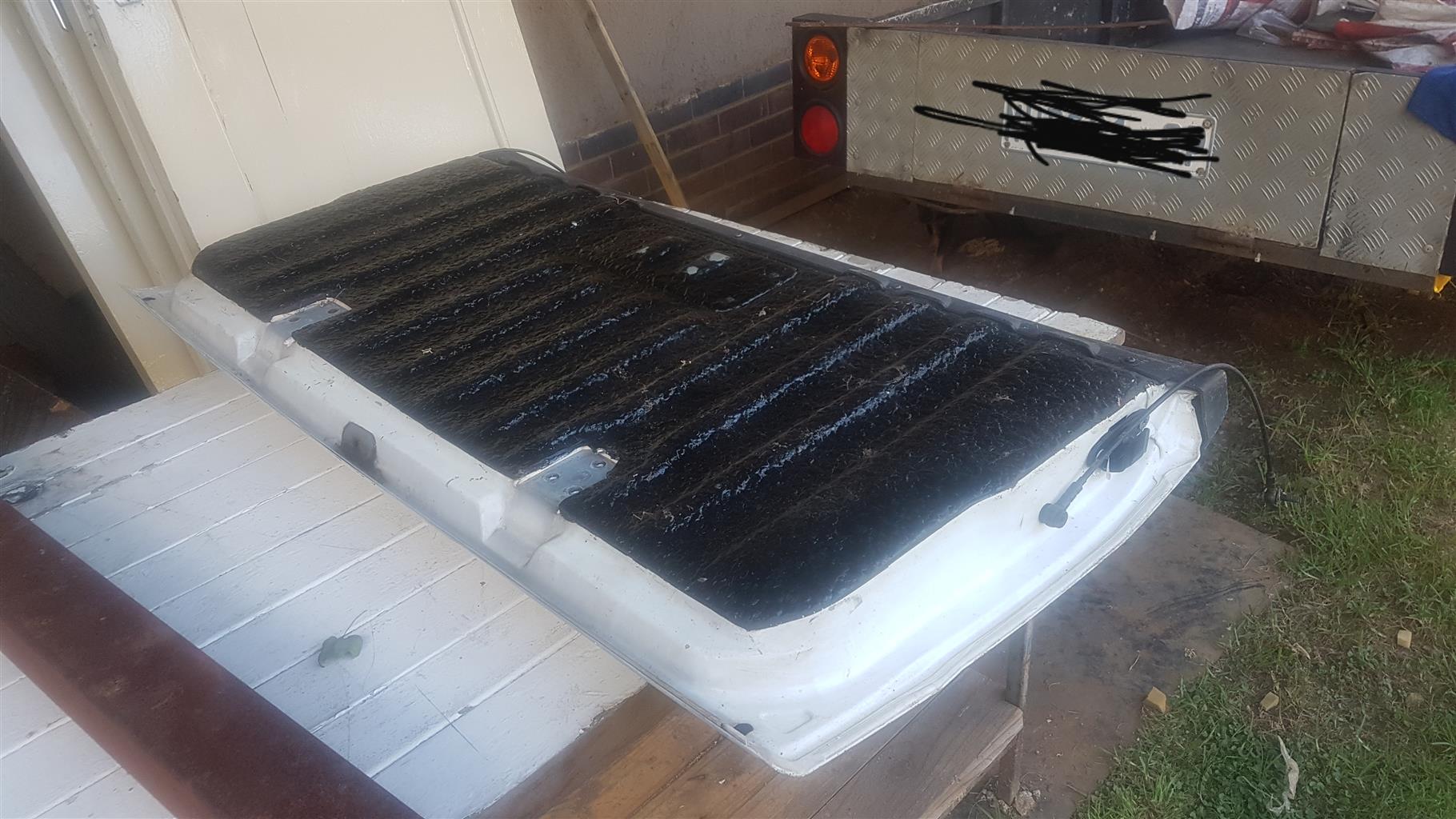 Nissan np200 tailgate with a dent in it but still working fine. - Private Seller Nissan np200 tailgate with a dent in it but still working fine. - Private Seller
