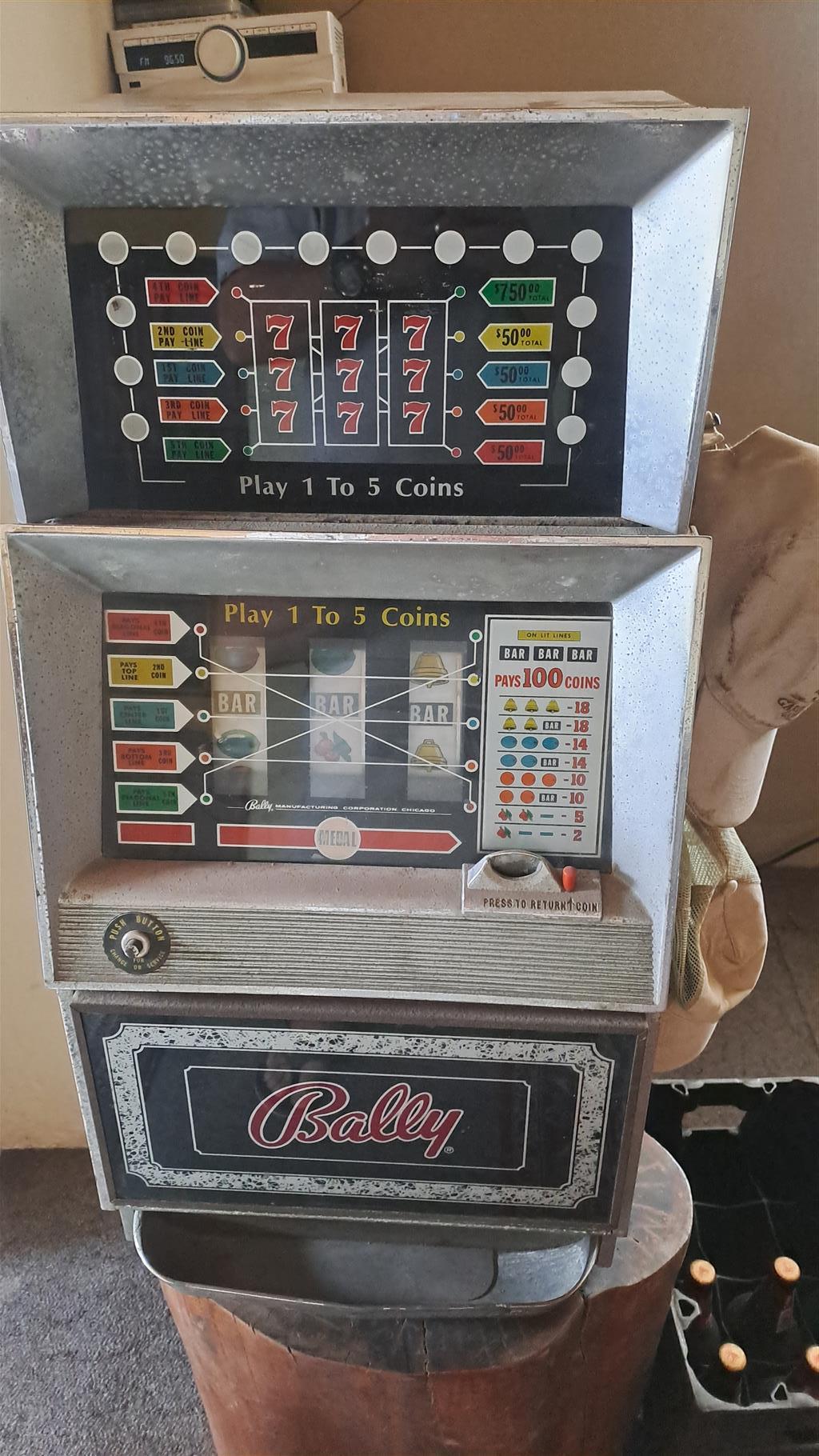 One arm bandit with original tokens in working order One arm bandit with original tokens in working order