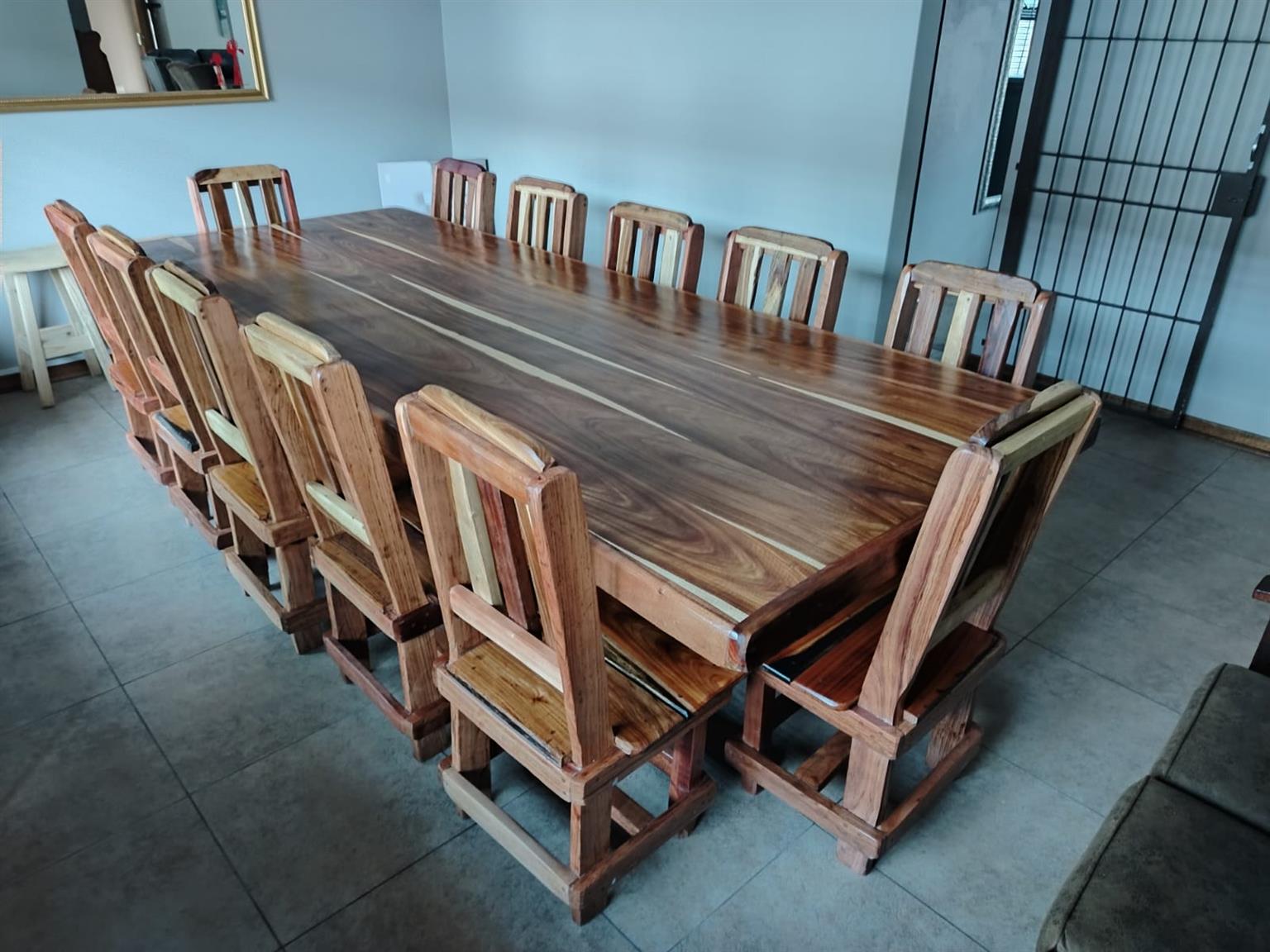 12 Seater sleeper wood table plus chairs | Junk Mail Marketplace