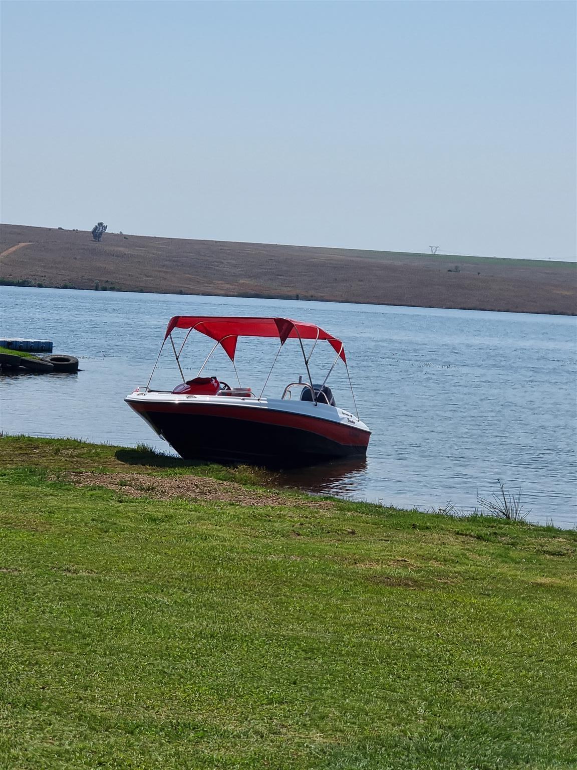 18 ft Exspression Funster boat with 150 Optimax Murcury Motor