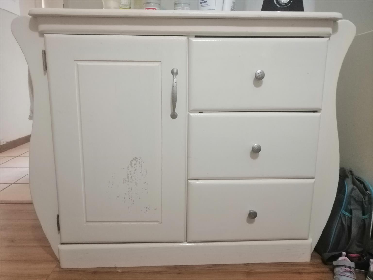 cot with cupboard