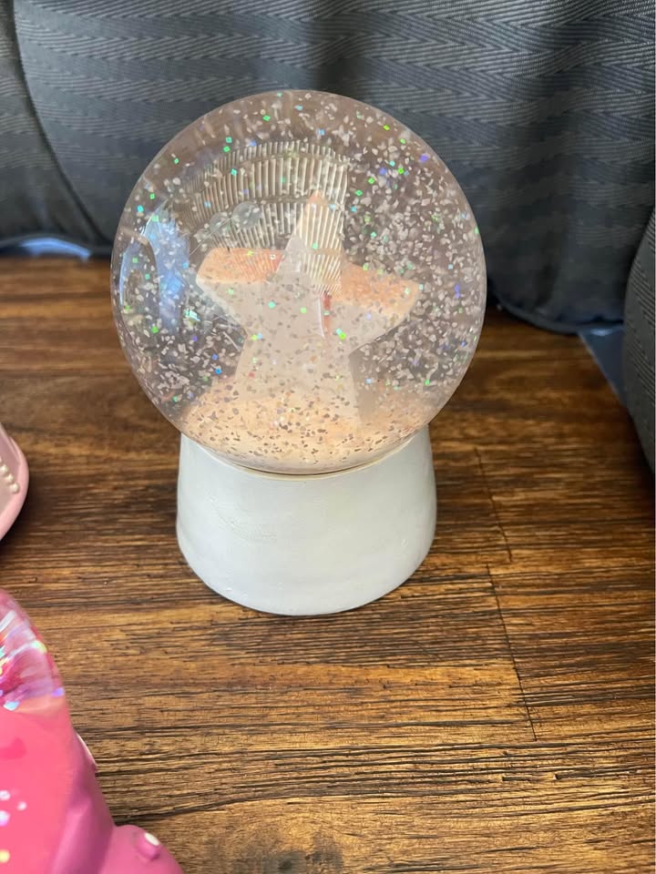 Collection of pink snow globes