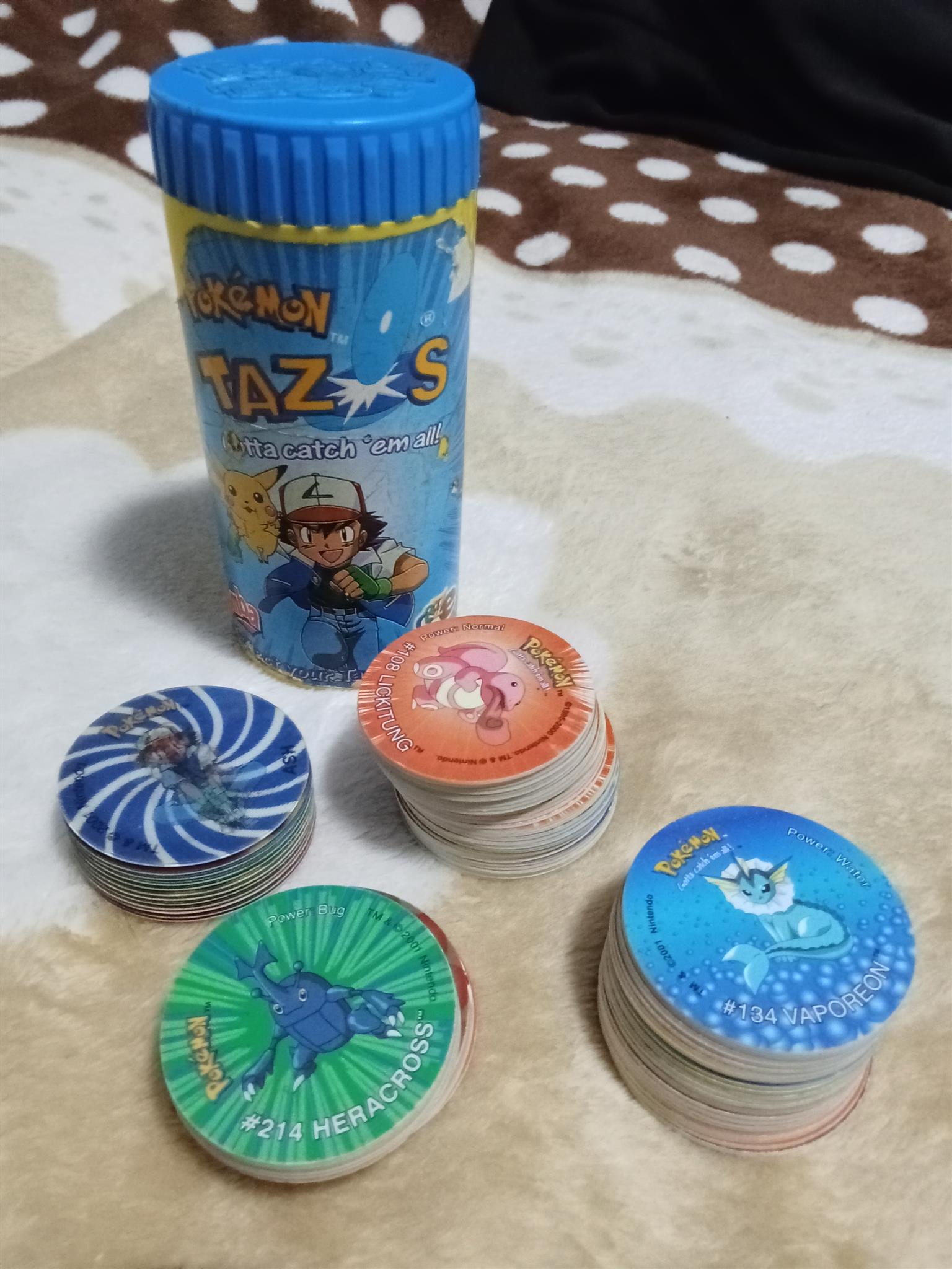 83× Pokemon Tazos with holder