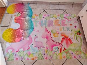 Dinosaur banner and foil balloon