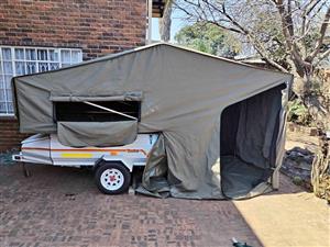 Camp trailer.