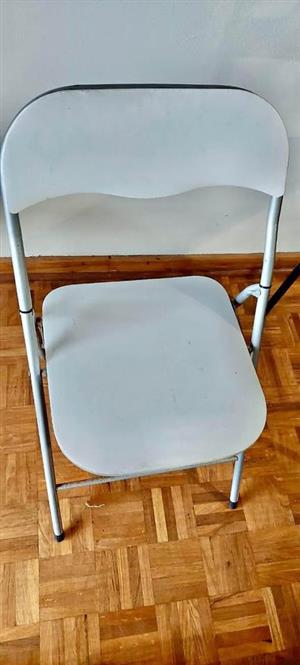 White padded fold up chair
