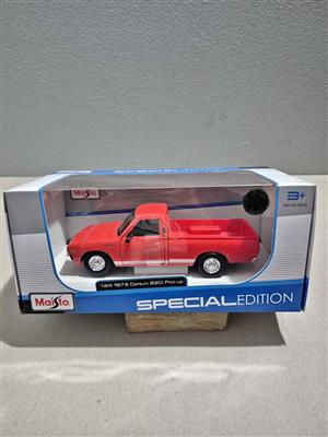 1:24 scale diecast metal model of a red 1973 Datsun 620 Pickup by Maisto Special Edition.
