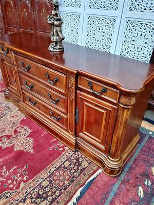 Classic Carved Wooden Dresser with Elegant Brass Handles