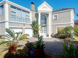 A Stunning Double-Storey Coastal Home with Breathtaking Ocean Views  Boggomsbaai