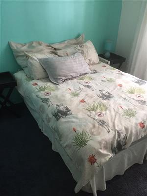 Double bed with floral linen