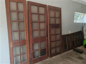 Solid wood pivot/folding doors with glass in tact and frame