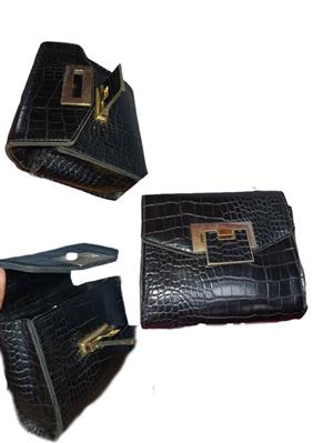 black croc-effect crossbody bag featuring a structured flap front, a gold-toned twist-lock closure,