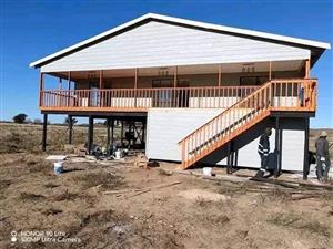 Log home on poles with balcony