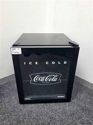 Husky 46L Coca-Cola counter-top beverage cooler in black.