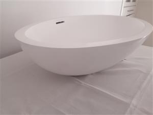 Dado quarts oval shape freestanding basin. 