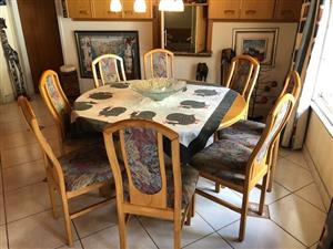 Dining 4 or 8 seater solid oak table and cushioned chairs. Normal for 4 person 1