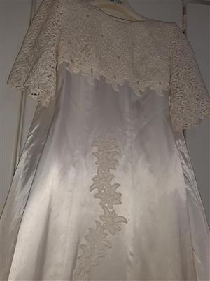 Wedding dress made of imported pure silk & brocate material with pearl's.