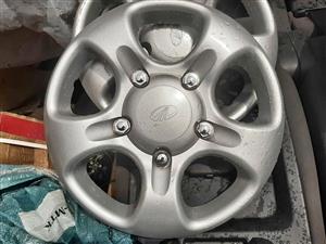MAHINDRA WHEEL CAPS A SET (4). SECOND HAND STILL GOOD FOR VARIOUS OTHER CARS TOO