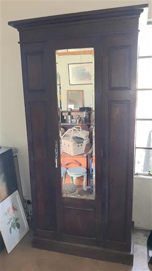Single-door, oak cupboard with shelves and bevelled mirror