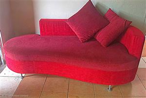 Red velvet curved chaise lounge or sofa bed
