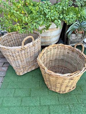 Pair of wooven rattan baskets with loop handles
