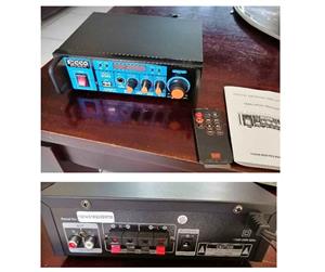 Bluetooth Mini Amp with remote, New with 1 year and includes delivery