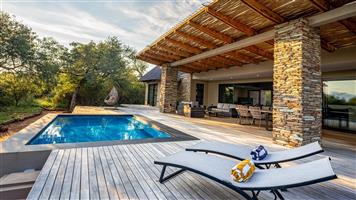 Contemporary Bushveld Home with Mountain Views Experience refined bush living in this spacious, mod