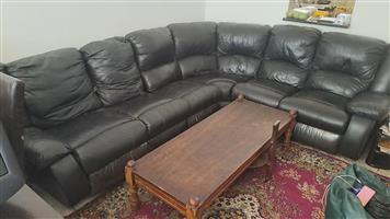 Genuine leather corner couch. 6 seater. With coffee table. Two of the chairs are