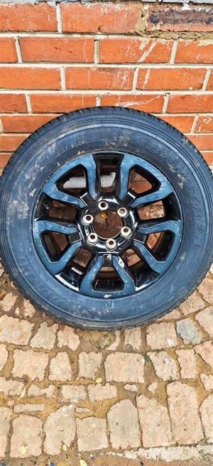 Toyota Legend RS OEM 18" mag with used 265/60/18 Dunlop Grandtrek AT to use for spare