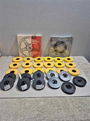 Vintage 8mm and Super 8mm film projector reels commonly used for home movies.