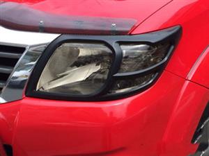 Toyota Hilux Matt Black Headlight Trim (2011up)