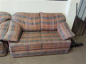 DOUBLE SEATER COUCH RED AND BLUE LINED PATTERN