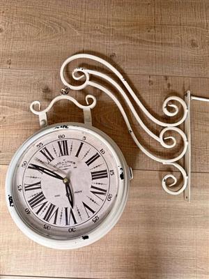 This decorative "Cafe de la Tour" double-sided wall clock