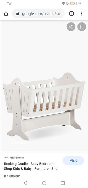 White wooden rocking cot