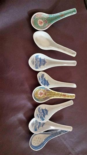 8 Chinese ceramic soup spoons, often featuring traditional blue and white willow patterns