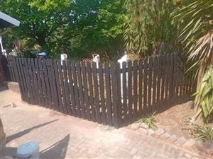 Solid wooden picket fence