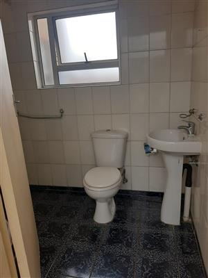 Round corner entry shower - toilet and basin