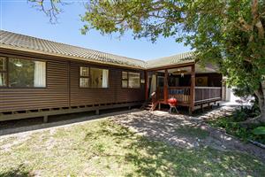 A delightful wooden home set amongst the trees in the Kleinemonde village.