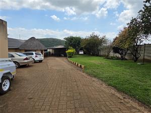 Versatile Farm Property with 4-Bedroom Home, Two Granny Flats & Extensive Facilities