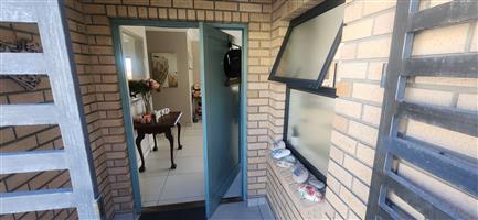 Versatile double-storey home with sea views and exceptional income potential.