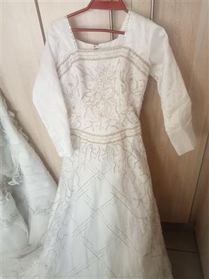 Beautiful beaded jasmins bridal gown with trail for sale 