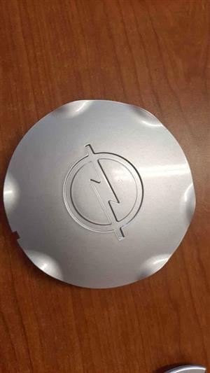 OPEL CENTER CAPS. FOR A SET. BRAND NEW. FOR VARIOUS OTHER CARS TOO.