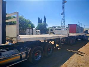 2000 - Hendred Fruehauf 6/12 Superlink Flat Deck Trailer now on sale  - Excellent condition