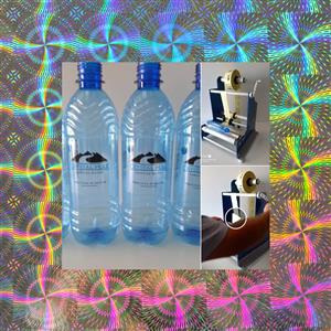 No‑power labelling machine for round bottles 