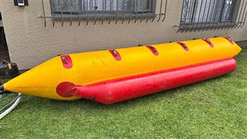 Boat PVC inflatable ride-on toy. (Aka banana, snake). 6-man. One stabiliser needs attention