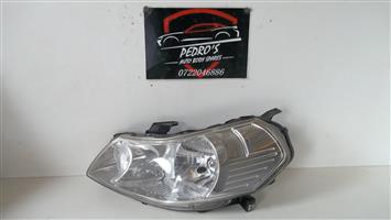 Suzuki SX4 left headlight